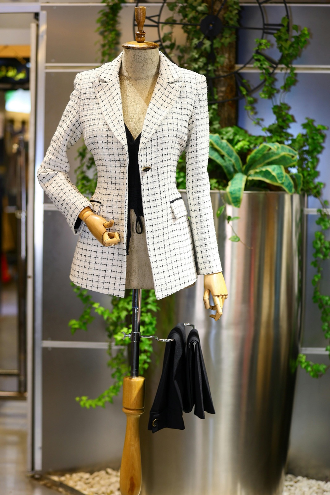 Tailored women's tweed blazer on artisan mannequin — bespoke ladies' tailoring at Outfit Tailor Koh Samui